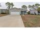 Charming home with a gray exterior, two-car garage, and well-manicured front lawn at 1668 Greenridge Dr., Conway, SC 29526