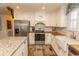 Modern kitchen with stainless steel appliances, white cabinetry, and butcher block countertops at 1668 Greenridge Dr., Conway, SC 29526