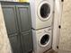 Functional laundry area with stacked washer and dryer and ample storage space at 1668 Greenridge Dr., Conway, SC 29526