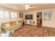 Bright living room boasts natural light, a large TV, and a patterned area rug at 1668 Greenridge Dr., Conway, SC 29526