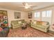 Inviting living room featuring neutral paint, ceiling fan, plush sofas, and an eye-catching area rug at 1668 Greenridge Dr., Conway, SC 29526