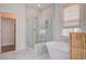 Elegant bathroom featuring a modern glass shower, a soaking tub, and refined marble accents at 1801 Tryon Dr, Myrtle Beach, SC 29588