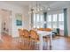 Bright dining room with hardwood floors and modern chandelier lighting at 1801 Tryon Dr, Myrtle Beach, SC 29588