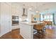 Bright, open kitchen with stainless steel appliances, a marble countertop island, and modern lighting fixtures at 1801 Tryon Dr, Myrtle Beach, SC 29588