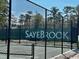 Sayebrook tennis court with a chainlink fence, adding privacy and security for a premier playing experience at 1801 Tryon Dr, Myrtle Beach, SC 29588