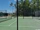 Green-surface tennis court offers an inviting space for recreational activities and friendly matches at 1801 Tryon Dr, Myrtle Beach, SC 29588