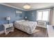 Inviting bedroom with blue walls, lots of natural light, and hardwood floors at 201 N 76Th Ave. N # B-2, Myrtle Beach, SC 29572