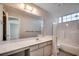 Bathroom with a large mirror, vanity, and bathtub at 2151 Clearwater Dr. # C, Surfside Beach, SC 29575