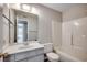 Well-lit bathroom features a vanity, mirror and tub-shower combo at 2151 Clearwater Dr. # C, Surfside Beach, SC 29575