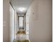 Hallway with tile flooring leading to various rooms, including a bedroom and bathroom at 2151 Clearwater Dr. # C, Surfside Beach, SC 29575