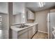 Bright kitchen featuring a stainless steel sink, white cabinets, and essential appliances at 2151 Clearwater Dr. # C, Surfside Beach, SC 29575