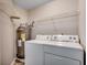Functional laundry room with washer, dryer, and a water heater at 2151 Clearwater Dr. # C, Surfside Beach, SC 29575