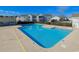 Refreshing community pool with clear blue water, surrounded by well-maintained landscaping at 2151 Clearwater Dr. # C, Surfside Beach, SC 29575