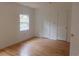 Bright bedroom with wood floors, neutral walls, and a window for natural light at 223 Greentown Rd., Georgetown, SC 29440