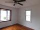 Cozy bedroom featuring hardwood floors and natural light from two windows, creating a warm ambiance at 223 Greentown Rd., Georgetown, SC 29440