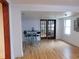 Open dining area with a modern table set, hardwood floors, and natural light from a window at 223 Greentown Rd., Georgetown, SC 29440