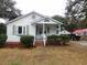 Charming one-story home with a covered front porch, green shutters, and landscaped front yard at 223 Greentown Rd., Georgetown, SC 29440