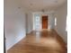 Bright living room featuring hardwood floors, a ceiling fan, and ample natural light from the windows at 223 Greentown Rd., Georgetown, SC 29440