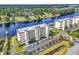 Aerial view of building with a waterfront view, parking, and landscaping at 249 Venice Way # 3301, Myrtle Beach, SC 29577