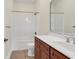 This bathroom features a shower-tub combo, cherry vanity and neutral ceramic tile at 249 Venice Way # 3301, Myrtle Beach, SC 29577