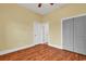 This bedroom features hardwood floors, a ceiling fan, and multiple doors at 249 Venice Way # 3301, Myrtle Beach, SC 29577