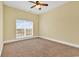 This bedroom is bright with carpet and a large window at 249 Venice Way # 3301, Myrtle Beach, SC 29577