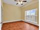 This bright bedroom features hardwood floors, a ceiling fan, and a window with blinds at 249 Venice Way # 3301, Myrtle Beach, SC 29577