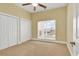 Bedroom with carpeting, closet, large windows and a ceiling fan at 249 Venice Way # 3301, Myrtle Beach, SC 29577