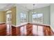 Bright dining area with hardwood floors, large windows, and a decorative chandelier at 249 Venice Way # 3301, Myrtle Beach, SC 29577