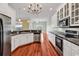 Bright kitchen with white cabinetry, stainless steel appliances, and an open-concept design at 249 Venice Way # 3301, Myrtle Beach, SC 29577