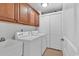 This spacious laundry room has cabinet storage and a utility sink at 249 Venice Way # 3301, Myrtle Beach, SC 29577