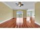 Unfurnished living room with hardwood floors, balcony access, and open concept design at 249 Venice Way # 3301, Myrtle Beach, SC 29577