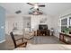 Comfortable living room featuring a large TV, vaulted ceilings, and a view into the dining area at 250 Ole Maple St., Loris, SC 29569