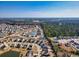 Community aerial shot of the neighborhood, featuring homes and small bodies of water at 263 Burchwood Ln., Myrtle Beach, SC 29588