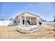 Back of home featuring a covered patio, spacious yard with a white picket fence at 263 Burchwood Ln., Myrtle Beach, SC 29588