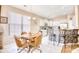 Well-lit dining area with a light fixture and a kitchen featuring stainless steel appliances and white cabinets at 263 Burchwood Ln., Myrtle Beach, SC 29588