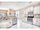 Bright kitchen featuring stainless steel appliances and granite countertops with a view to the naturally lit living space at 263 Burchwood Ln., Myrtle Beach, SC 29588