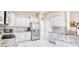 Well-equipped kitchen featuring stainless steel appliances, granite countertops, and white cabinetry at 263 Burchwood Ln., Myrtle Beach, SC 29588