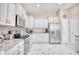 Well-equipped kitchen boasting stainless steel appliances, granite countertops, and white cabinetry at 263 Burchwood Ln., Myrtle Beach, SC 29588