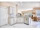 Modern kitchen features stainless steel appliances and a view to the naturally lit dining area at 263 Burchwood Ln., Myrtle Beach, SC 29588