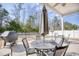 Covered patio area featuring a ceiling fan, with outdoor furniture and a grill at 263 Burchwood Ln., Myrtle Beach, SC 29588