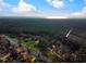 Aerial view showcases property near waterway with a densely forested landscape and distant ocean views at 270 Georgetown Dr., Pawleys Island, SC 29585