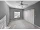 Neutral bedroom featuring a ceiling fan, window, and a double-door closet at 270 Georgetown Dr., Pawleys Island, SC 29585