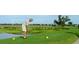 Personal prepares to tee off in front of a beautiful golf course and a green pond at 270 Georgetown Dr., Pawleys Island, SC 29585