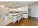 Kitchen with white cabinets, seating area, and wood floors at 270 Georgetown Dr., Pawleys Island, SC 29585