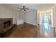 Bright living room with fireplace, built-in shelving and hardwood floors leading to the entryway at 270 Georgetown Dr., Pawleys Island, SC 29585