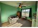 Bright bedroom with a sofa, ceiling fan, and natural light from the window at 3108 Robins Nest Way, Myrtle Beach, SC 29579