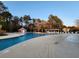 Large swimming pool with lounge chairs and shade structure at 3108 Robins Nest Way, Myrtle Beach, SC 29579