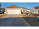 Inviting single-story home with a spacious two-car garage and a well-maintained lawn at 3108 Robins Nest Way, Myrtle Beach, SC 29579