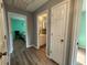 Hallway view showcasing access to a bathroom and bedroom at 3108 Robins Nest Way, Myrtle Beach, SC 29579